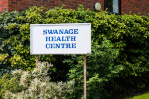 Sign outside the Swanage Medical Centre