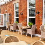 Rattan dining furniture in the conservatory area, Swanage Grand