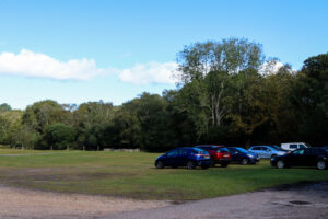 Cars parked near the entrance of Blue Pool in Furzebrook