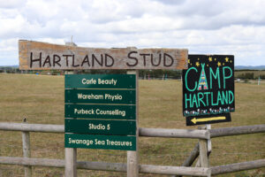 Signage for Camp Hartland and businesses at Hartland Stud, near Corfe Castle