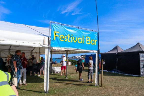 People at the beer tent in Sandpit Field for the Swanage Folk Festival