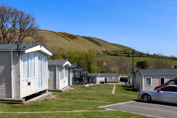 The Purbeck Ridgeway behind a row of static caravans at Ulwell Holiday Park