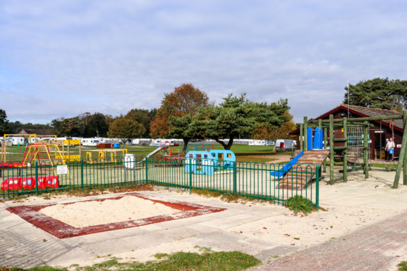 Kid's sandpit in the playground area by the laundry room of Wareham's Birchwood Tourist Park