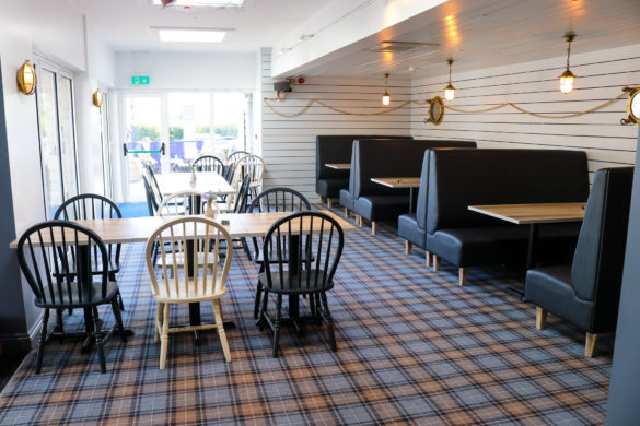 Black and white seating with nautical design in the Village Inn restaurant, Swanage