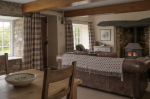 Living room and dining area of Knaveswell Farm holiday cottage, near Swanage
