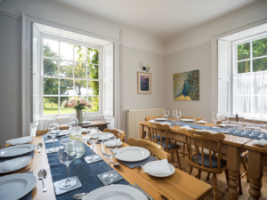 Tables set for 14 guests at Georgian Norden House, Purbeck