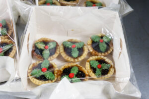 Handmade mince pies with holly and berry decoration, Hartland Stud Christmas Fair