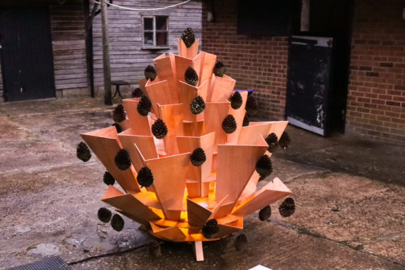 Lit wooden Christmas tree sculpture with pine cones, Hartland Stud