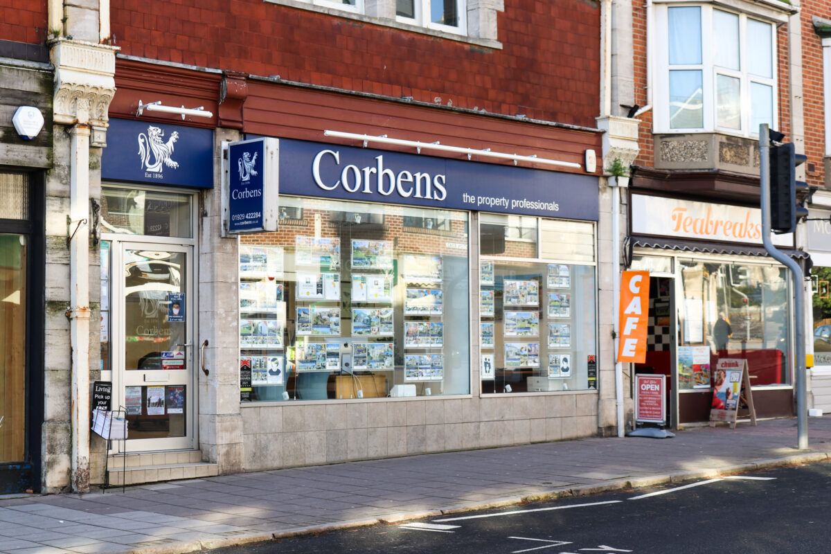 Window frontage of Corbens estate agents in Swanage