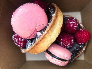 Raspberry and macaroon dark chocolate tarts by Lovel Cake catering at PAW