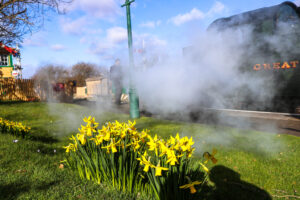 Train enveloped by steam at Harman's Cross railway station
