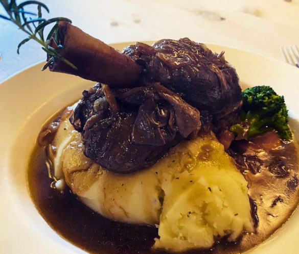 Lamb shank, mashed potato, broccoli and gravy main course at The Black Swan in Swanage