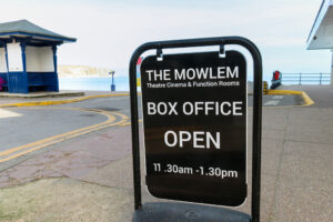 The Mowlem box office sign on Shore Road by Swanage Beach