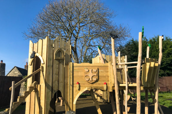 Wooden climbing frame in the park at Corfe in the shape of a castle