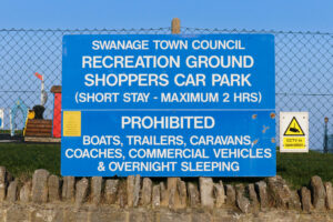 Car parking sign at Mermond Place, Swanage, with the Chadwick playground in the background