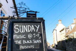 Sunday music blackboard outside the front of the Black Swan in Swanage