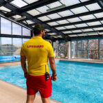A lifeguard on duty at the swimming pool of Swanage Bay View Holiday Park