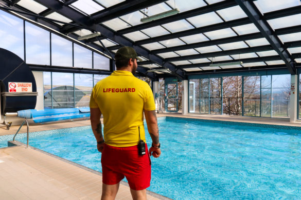 A lifeguard on duty at the swimming pool of Swanage Bay View Holiday Park