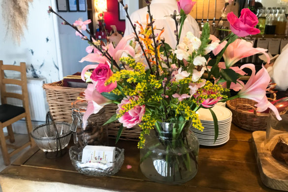 Spring flowers on the counter at Corfe Castle's Pink Goat café