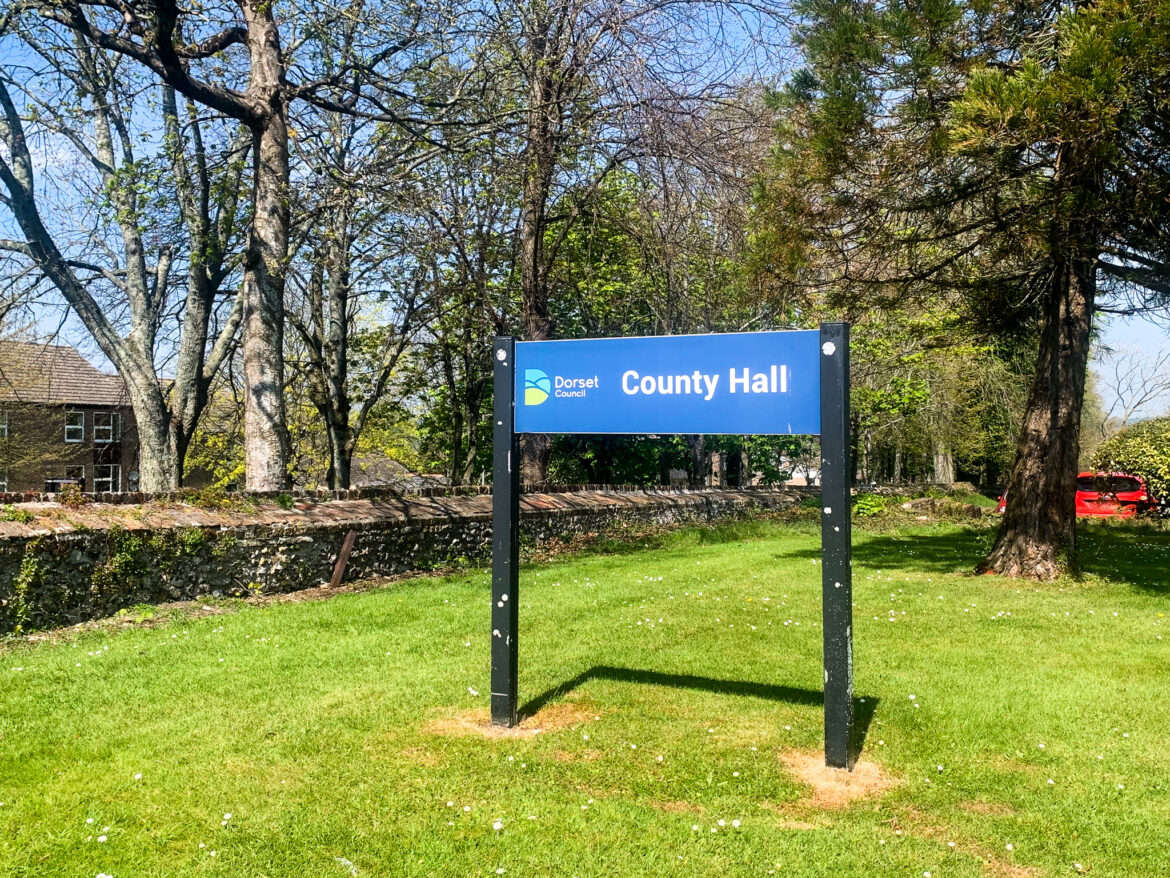 Dorset Council sign outside County Hall at Colliton Park in Dorchester