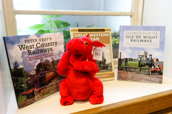 Red dragon stuffed toy and UK railway books for sale at the Swanage Railway shop