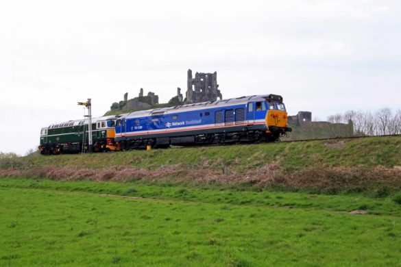 Heritage locomotives passing by Corfe Castle for the Swanage diesel gala