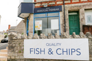 Outside the fish & chip shop in Hertson, Swanage