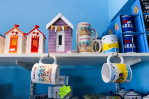 Swanage mugs and beach hut trinkets at The Beach Shop