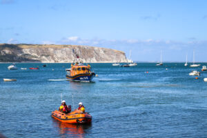 Swanage's two RNLI lifeboats, with Old Harry Rocks & Ballard Down behind