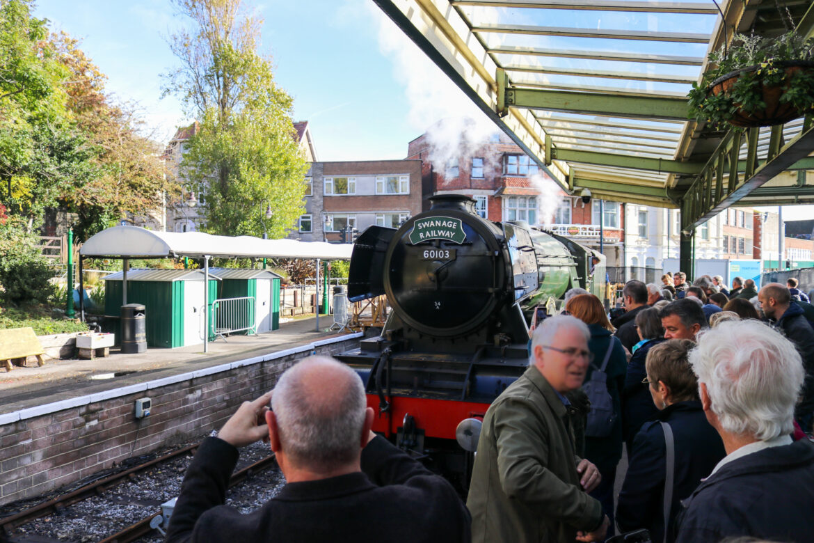 People taking photographs of the Flying Scotsman loco in Swanage