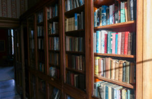 Glass bookshelves at Purbeck House Hotel