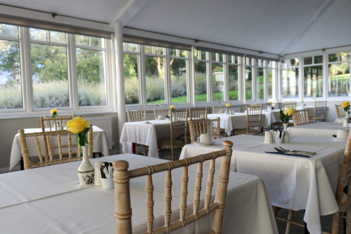 Purbeck House Hotel conservatory set for breakfast