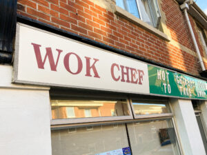 Signage outside Chinese takeaway Wok Chef, Swanage