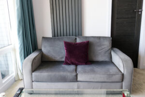 Grey sofa in premium room at The Pines Hotel, Swanage